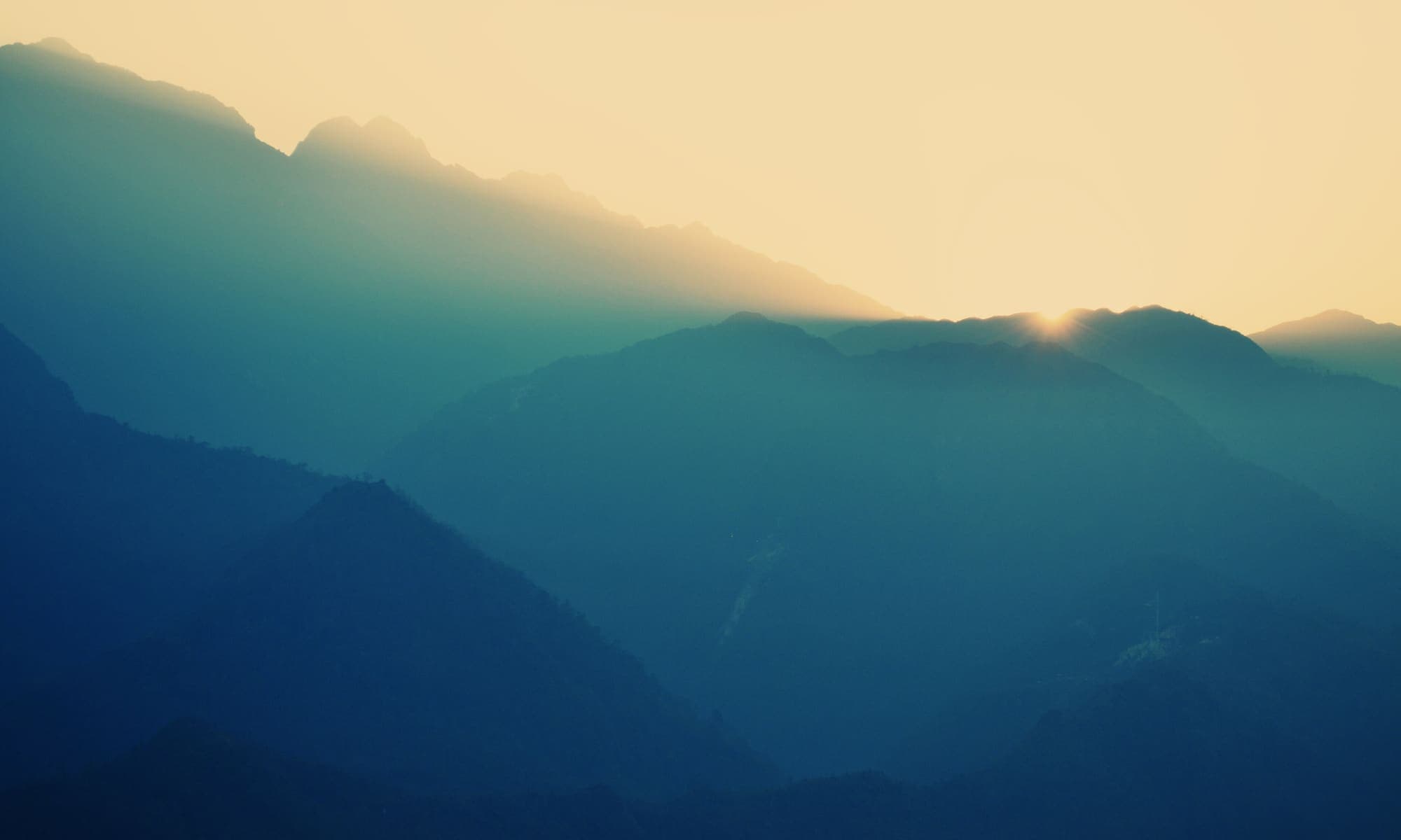 Hazy highland mountains at dusk near Da Lat