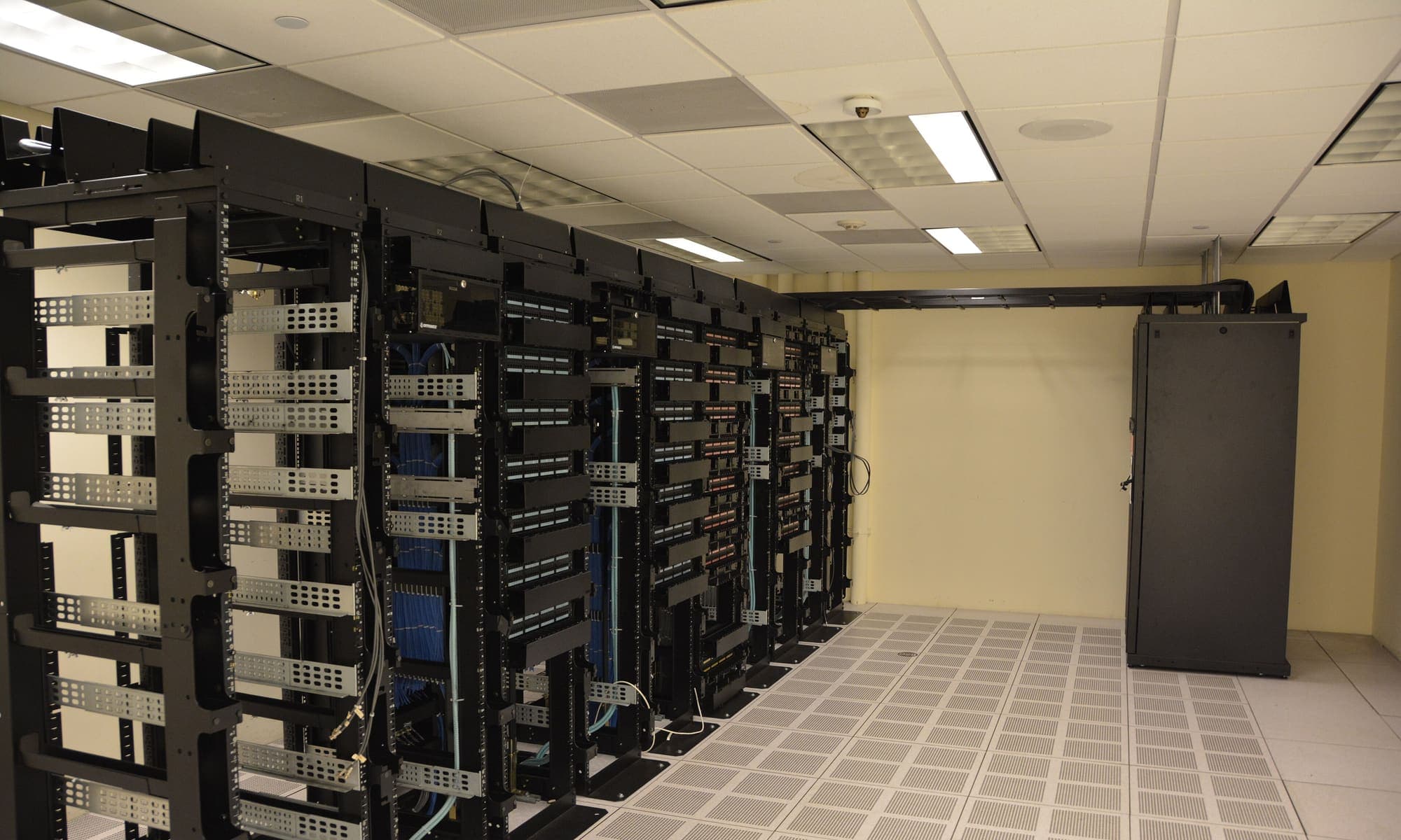Rows of server racks in a data centre aisle
